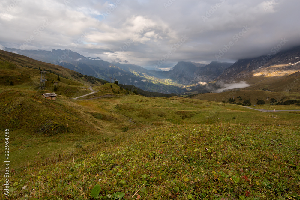 Fototapeta premium Cloudy sunset in mountains