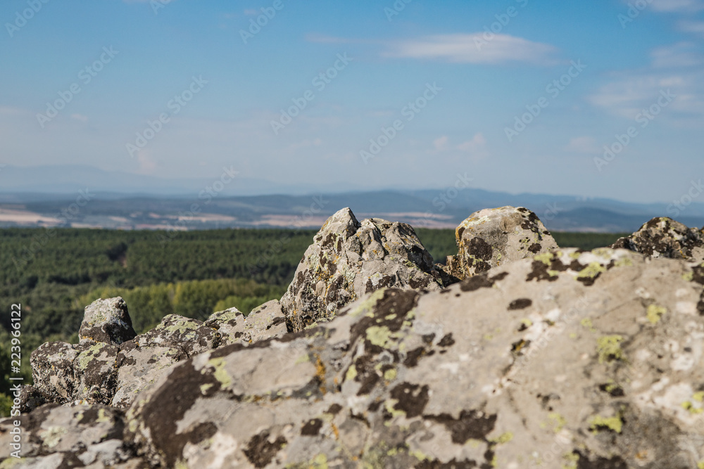 stones on top of a hilltop with valley views