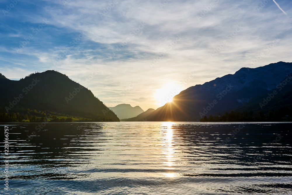 Beautiful mountain sunset with reflection in Austrian Alps. Grundlsee
