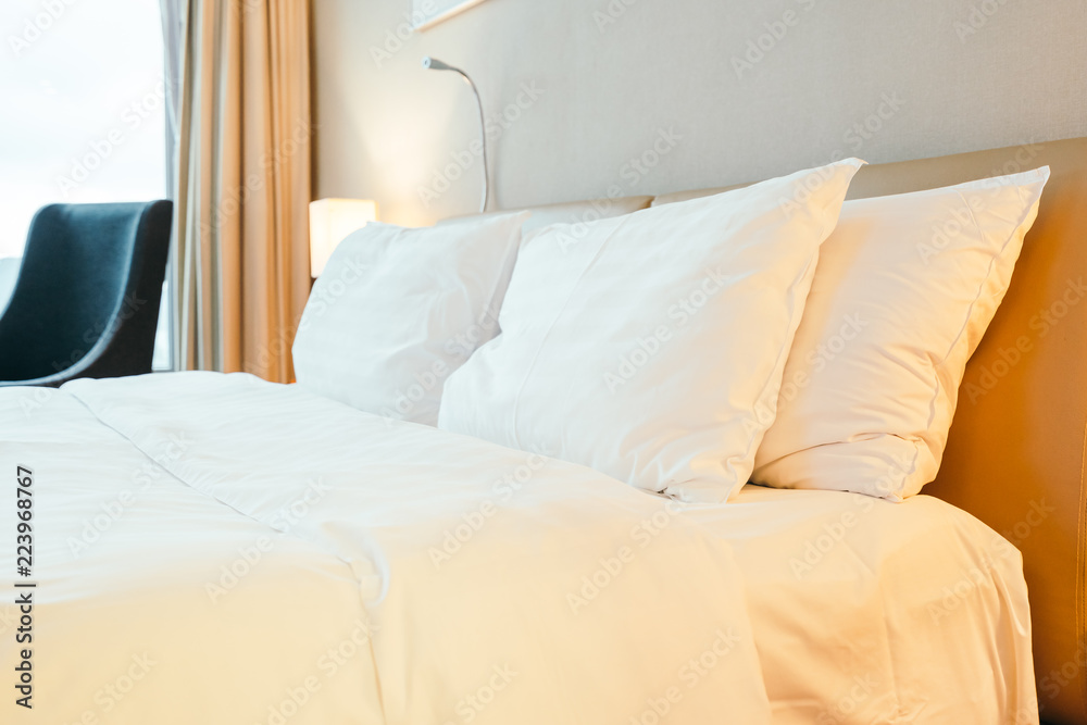 White pillow on bed decoration in bedroom interior White pillow on bed decoration in bedroom interior