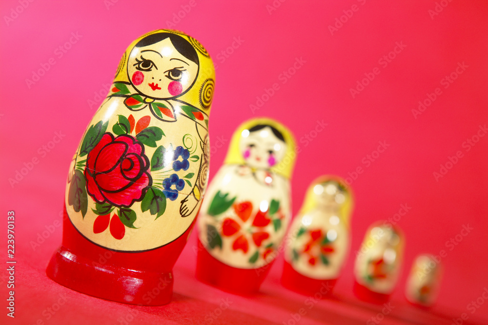 RUSSIAN DOLLS ON RED PINK BACKGROUND