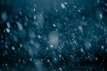 Snowflakes against black background for adding falling snow texture into your project. Add this picture as "Screen" mode layer in Photoshop to add falling snow to any image.