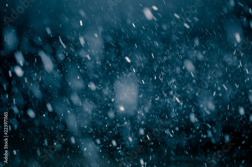 Snowflakes against black background for adding falling snow texture into your project. Add this picture as "Screen" mode layer in Photoshop to add falling snow to any image.