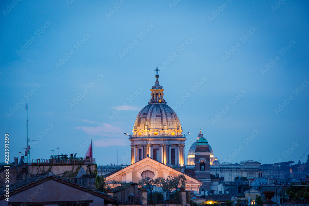 Blue hour view of the Basilica of Saints Ambrose and Charles the Corso, Rome