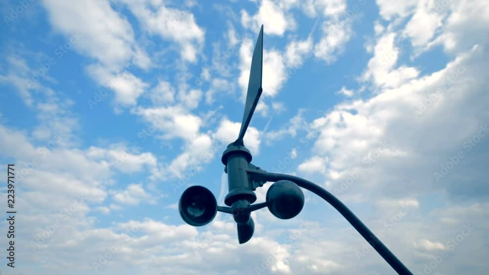 weather forecast concept. Wind turbine is slowly rotating in the open air.