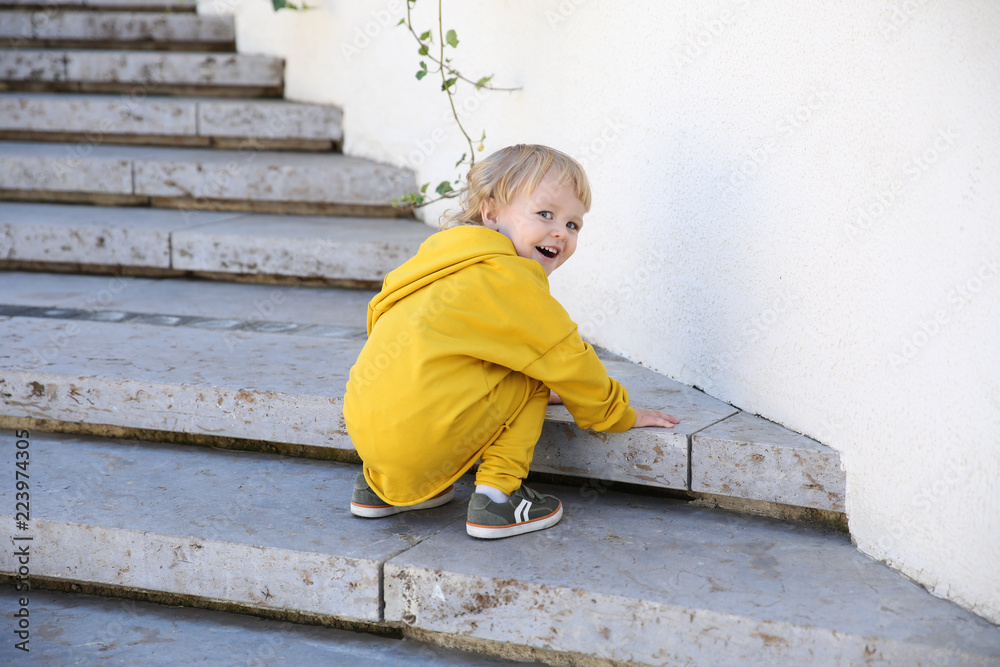 happy child in stylish sportswear in the park outdoors happy child in stylish sportswear in the park outdoors