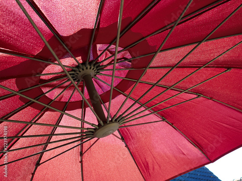 Outdoor red parasol umbrella in the garden