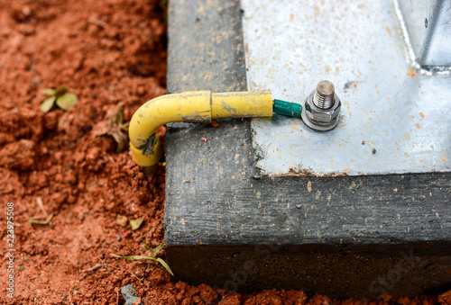 Install ground wire cable at the concrete base. photo