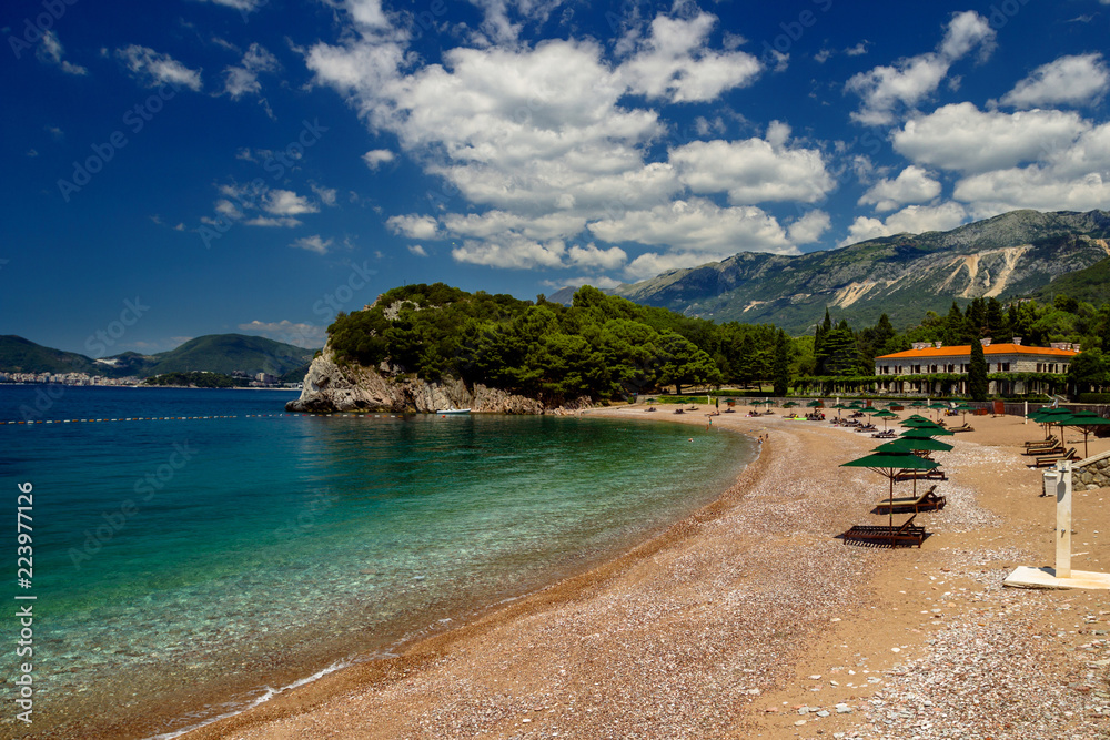 Parasol and a beautiful beach on the Adriatic Sea. Montenegro.