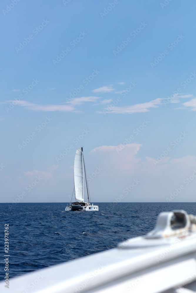 Obraz premium white catamaran sailing