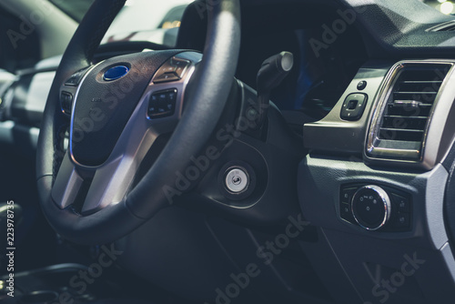 interior of a modern car with steering wheel tone Luxury © ahimaone