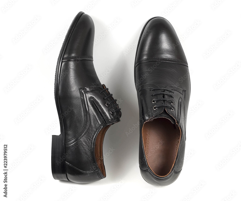 Classic male black leather shoes isolated on a white, top view Classic male black leather shoes isolated on a white, top view