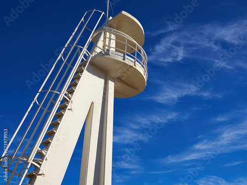 White lifeguard watch tower by the ocean