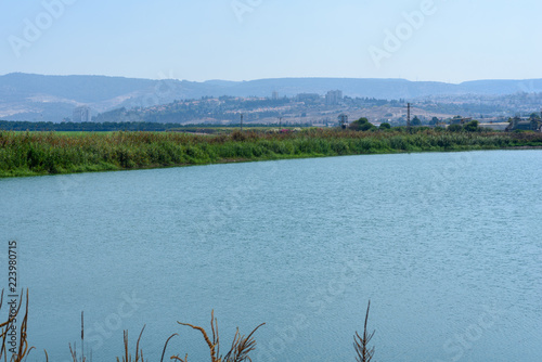 Idyllic landscape with clear lake, mountane and blue sky. photo