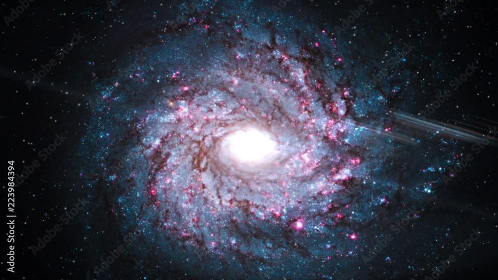 Spiral galaxy rotating in outer space on star field flare light at center. Contains public domain image by NASA