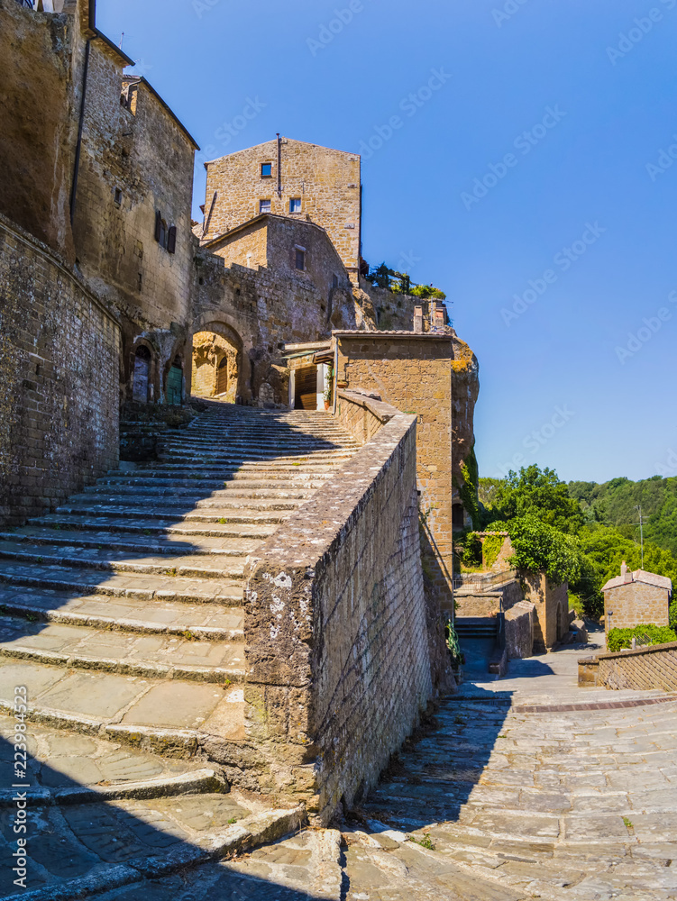 Medieval building in Via Porta di Savona in Pitigliano. June 2017 Pitigliano, Tuscany - Italy