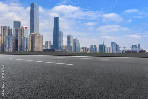 Road pavement and Guangzhou city buildings skyline © 昊 周