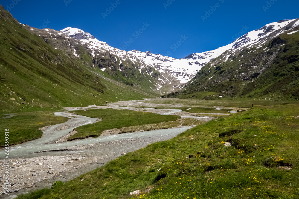 View of the Val Fex (Graubunden, Switzerland) in the summer. It is a southern side valley from the Upper engadin in Switzerland, located at an altitude of around 1,800 to 2,000 metres View of the Val Fex (Graubunden, Switzerland) in the summer. It is a southern side valley from the Upper engadin in Switzerland, located at an altitude of around 1,800 to 2,000 metres