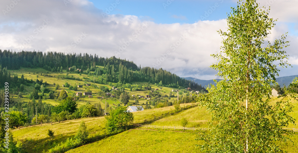 Slopes of mountains and clouds in the evening sky. Location place Carpathian, Ukraine, Europe. Concept ecology protection. Wide photo.