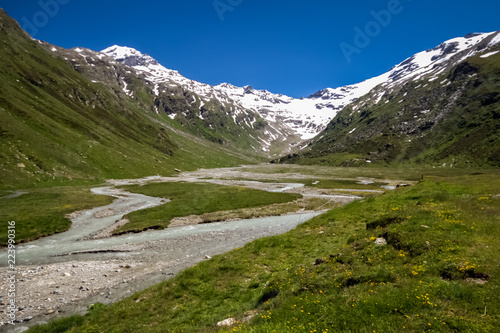 View of the Val Fex (Graubunden, Switzerland) in the summer. It is a southern side valley from the Upper engadin in Switzerland, located at an altitude of around 1,800 to 2,000 metres  photo