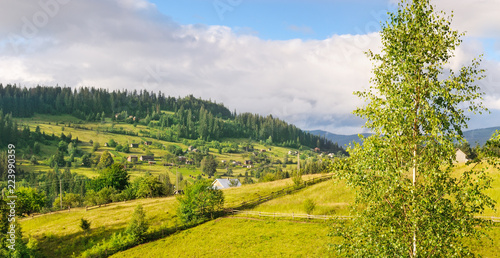 Slopes of mountains and clouds in the evening sky. Location place Carpathian, Ukraine, Europe. Concept ecology protection. Wide photo.