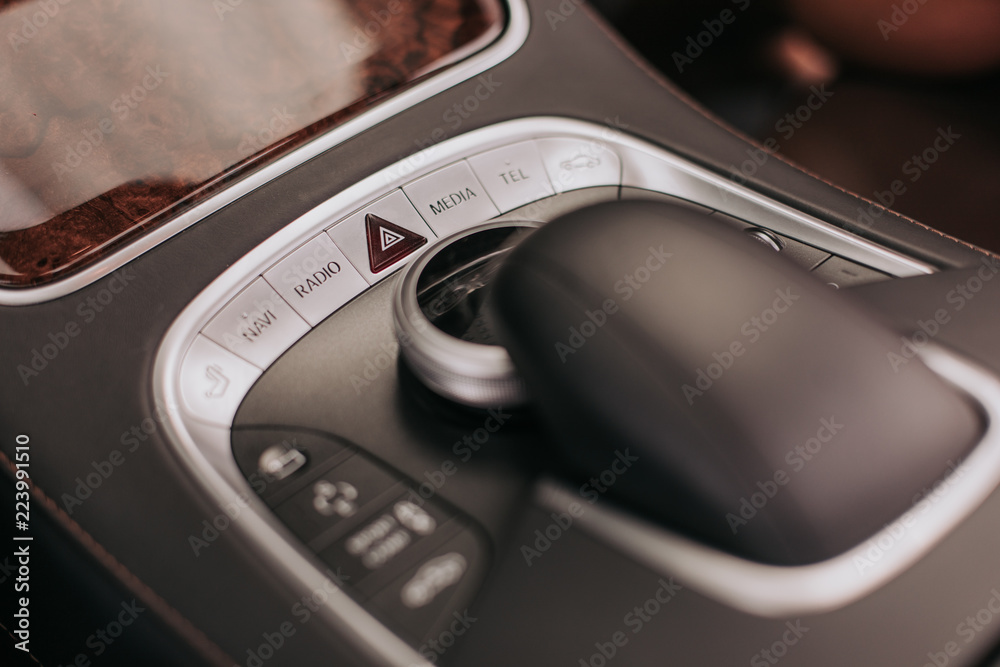 Close up dashboard with different button and emergency light in modern comfortable automobile