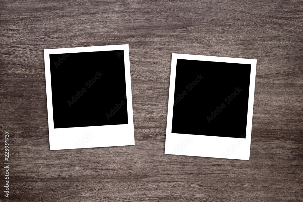 two blackened instant photo print templates on rustic wooden background two blackened instant photo print templates on rustic wooden background