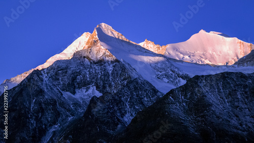 Mountains surrounding Grachen on a clear autumn morning during sunrise (Valais, Switzerland). The village is situated at an altitude of 1,620 meters on a terrace above St. Niklaus in the Mattertal photo