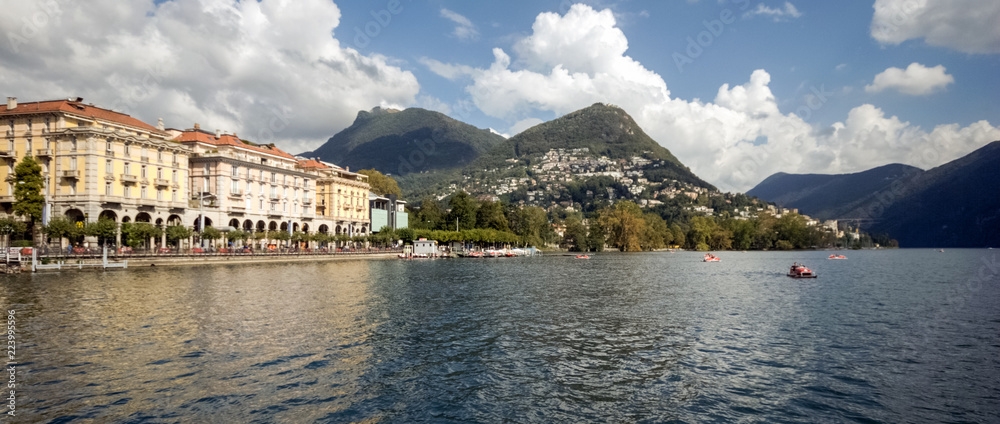 When taking a boat from Lugano to Gandria on the Lake Lugano you can enjoy gorgeous views on the city of Lugano in the canton of Ticino (Switzerland)