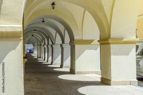 Passage, columns near old houses in the city