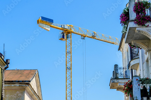 High-altitude crane yellow color on a blue sky background photo