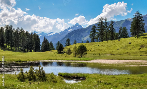 Mountains surrounding Tarasp  a village in the canton of Graubunden  Switzerland. It is situated within the Lower Engadin valley along the Inn River  at the foot of the Sesvenna Range.