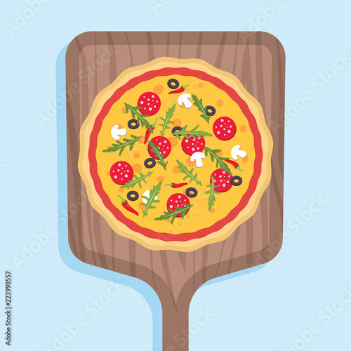 Pizza on a wooden shovel for a stove