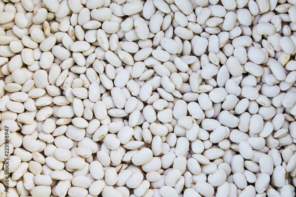 Haricot, white pea, raw common beans, white kidney  beans texture background or pattern. Raw legume food.