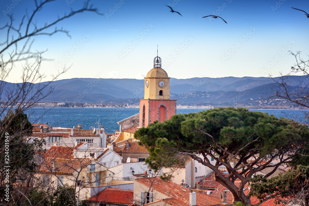View of the old town with tiled roofs and the Gulf of Saint Tropez, beautiful scenery, a trip to the French Riviera in Provence in France