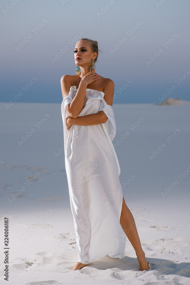 girl in a white tunic against the background of a night desert girl in a white tunic against the background of a night desert