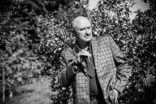 Mature Americanman with a sad philosophical mood. The concept of life after 50-60 years, problems and depression. Crisis in senior life, autumn time 