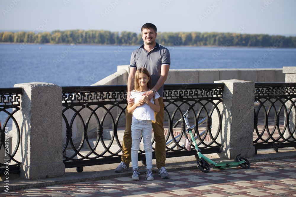 Portrait of a young father with his daughter