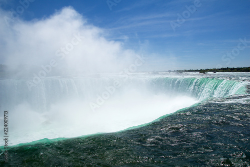 NIAGARA FALLS  ONTARIO  CANADA - MAY 21st 2018  Edge of the Horseshoe Falls as viewed from Table Rock in Queen Victoria Park in Niagara Falls