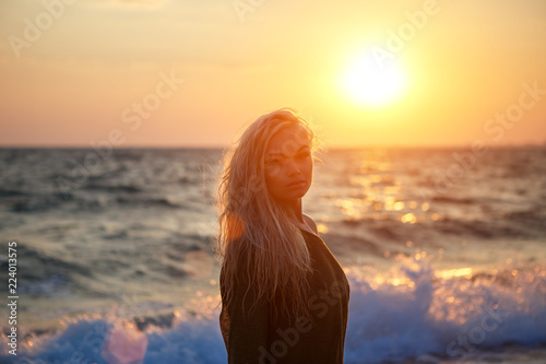 portrait of a beautiful girl on the beach at sunset © Екатерина Переславце