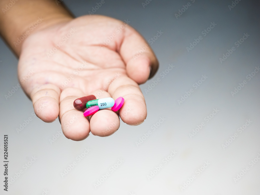 drug capsule medical in hand man wood background drug capsule medical in hand man wood background