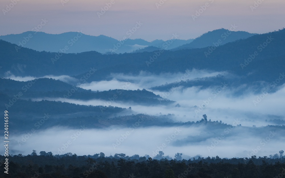 Sunrise in Northern Thailand with a misty landscape and hills