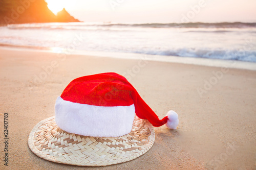 Christmas Santa hat on the beach. are texture Nature background creative tropical layout made at phuket Thailand