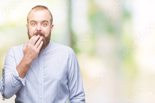 Young caucasian hipster man over isolated background looking stressed and nervous with hands on mouth biting nails. Anxiety problem.