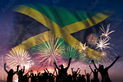 People are looking on fireworks and flag of Jamaica photo