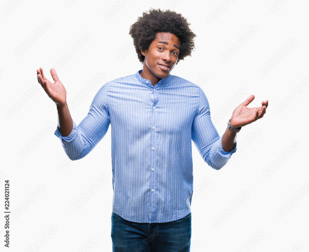 Afro american man over isolated background clueless and confused expression with arms and hands raised. Doubt concept. Afro american man over isolated background clueless and confused expression with arms and hands raised. Doubt concept.