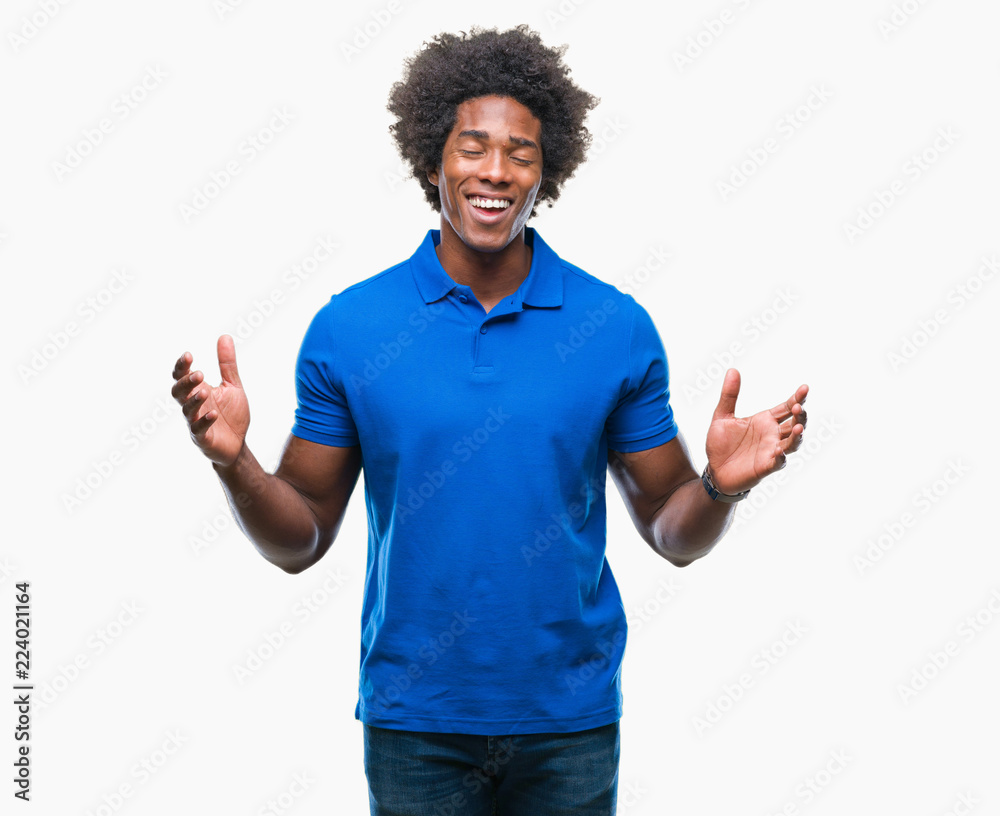 Afro american man over isolated background celebrating mad and crazy for success with arms raised and closed eyes screaming excited. Winner concept Afro american man over isolated background celebrating mad and crazy for success with arms raised and closed eyes screaming excited. Winner concept