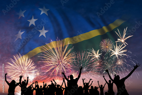 People are looking on fireworks and flag of Solomon Islands