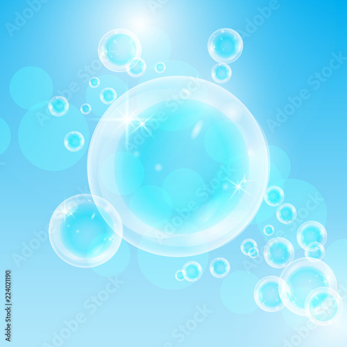 Realistic soap bubbles with rainbow reflection set isolated on the blue background © liagloss
