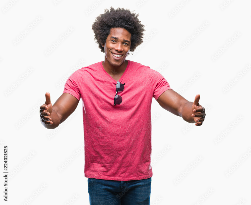 Afro american man over isolated background looking at the camera smiling with open arms for hug. Cheerful expression embracing happiness. Afro american man over isolated background looking at the camera smiling with open arms for hug. Cheerful expression embracing happiness.